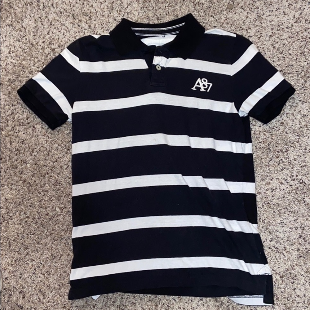 Lightly worn short sleeved collared shirt.